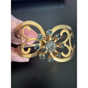 Mid-century gold-tone hinged cuff clamper bracelet, 1940s to 1950s.